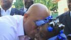 Haiti President Michel Martelly kissing a Haitian school girl
